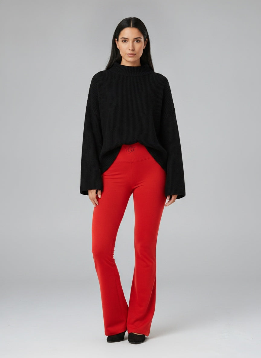 Full body view of the model wearing Sacred High Rise Flared Leggings